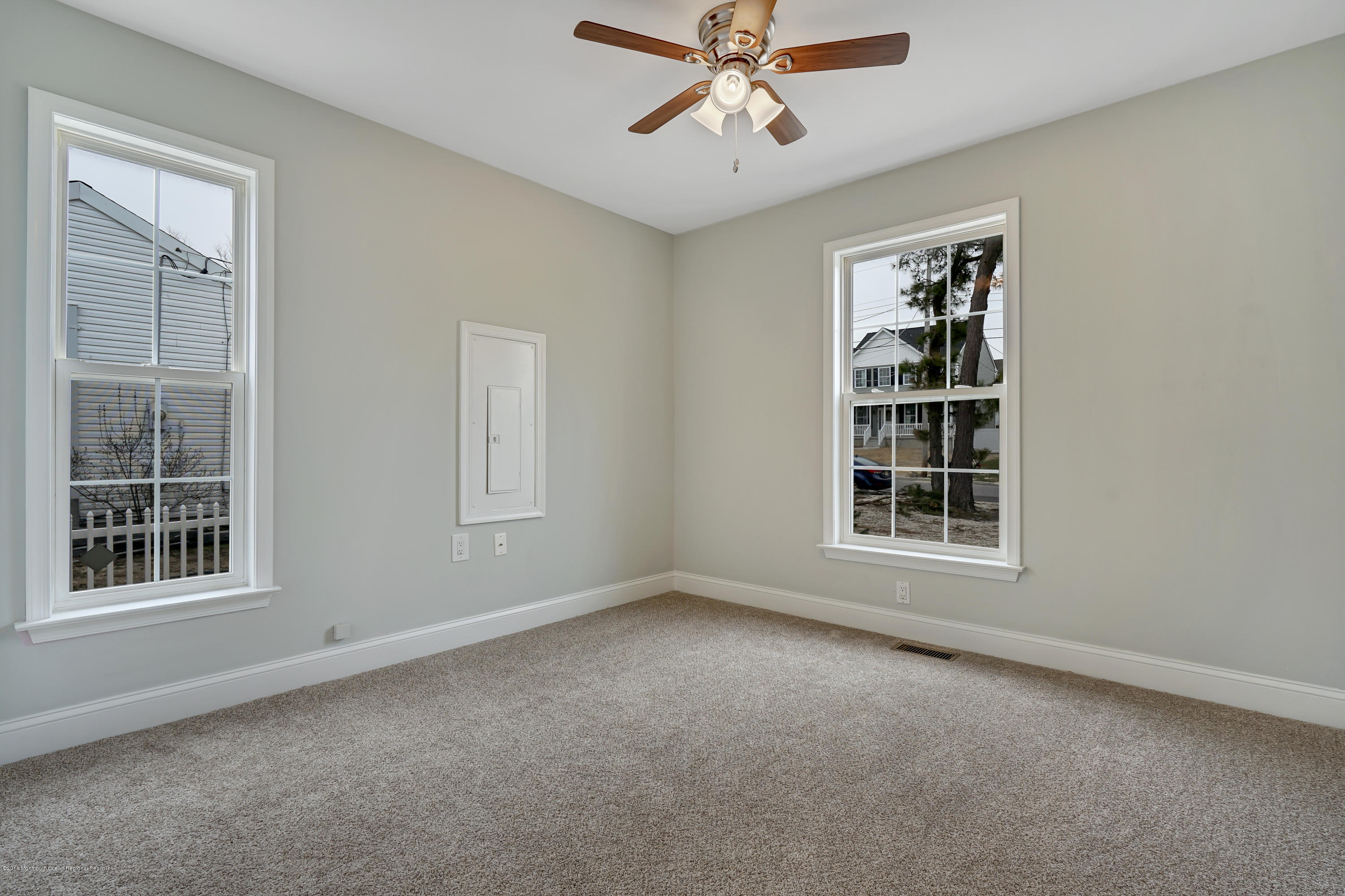 152 Bowline Road Manahawkin, NJ 08050 - Photo 15 of 29 an empty room with windows and fan