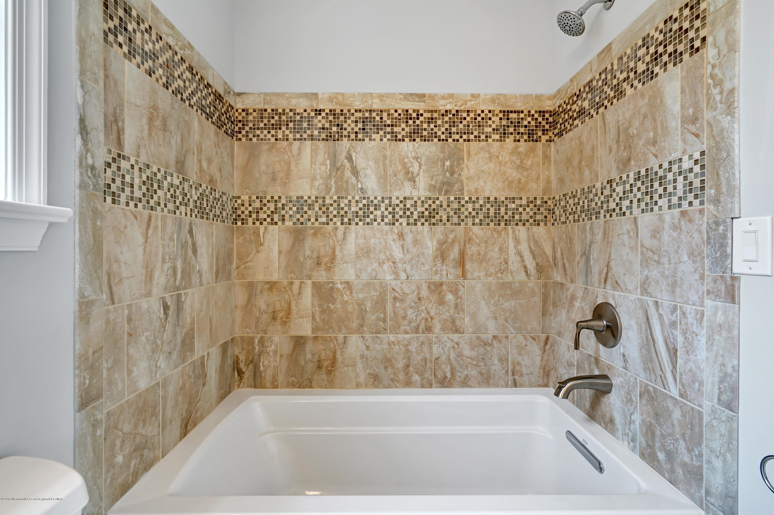 152 Bowline Road Manahawkin, NJ 08050 - Photo 19 of 29 a bathroom with a bathtub and shower