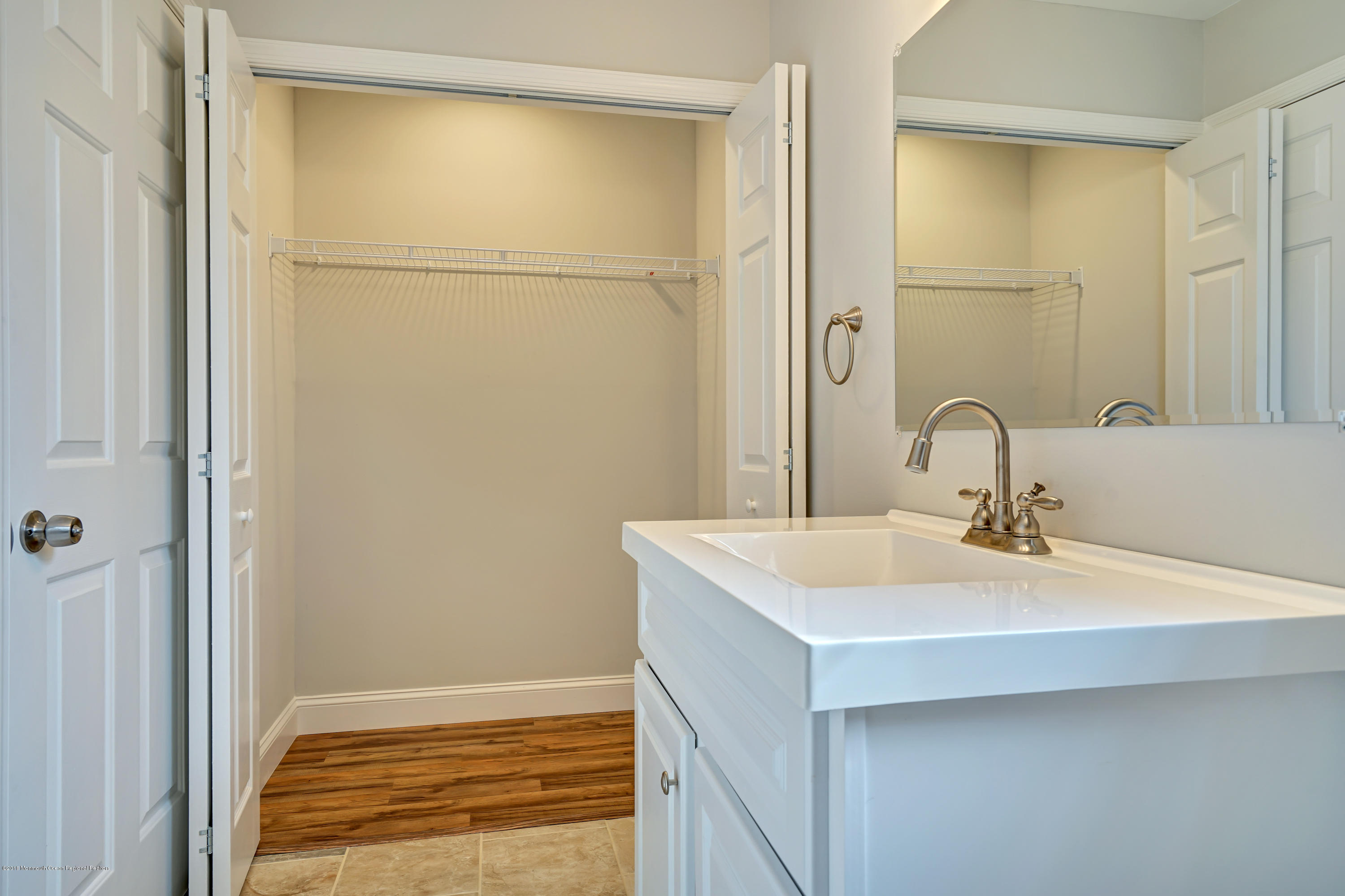 152 Bowline Road Manahawkin, NJ 08050 - Photo 20 of 29 a bathroom with a sink and a mirror