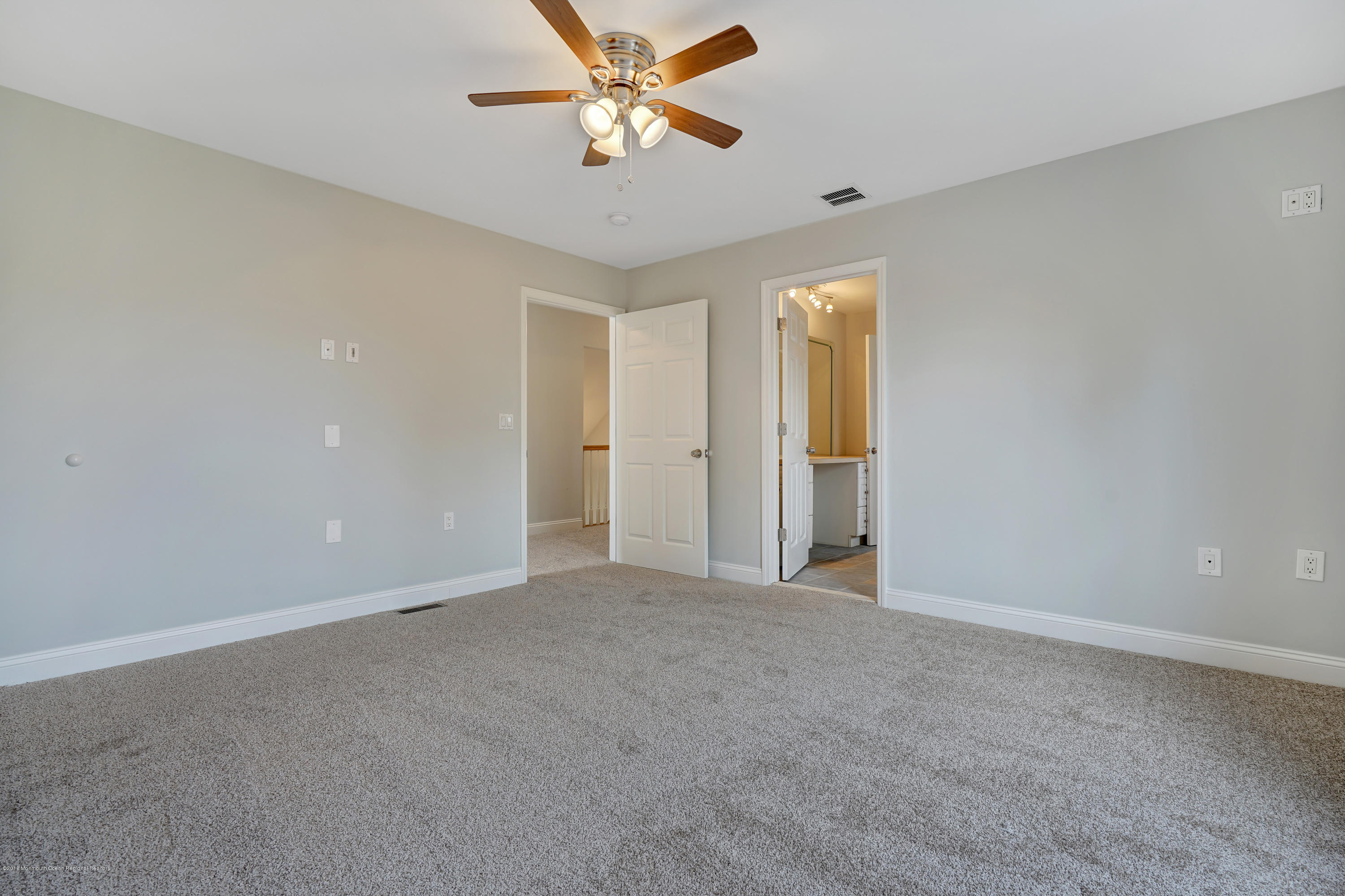 152 Bowline Road Manahawkin, NJ 08050 - Photo 23 of 29 a view of an empty room with a ceiling fan and window