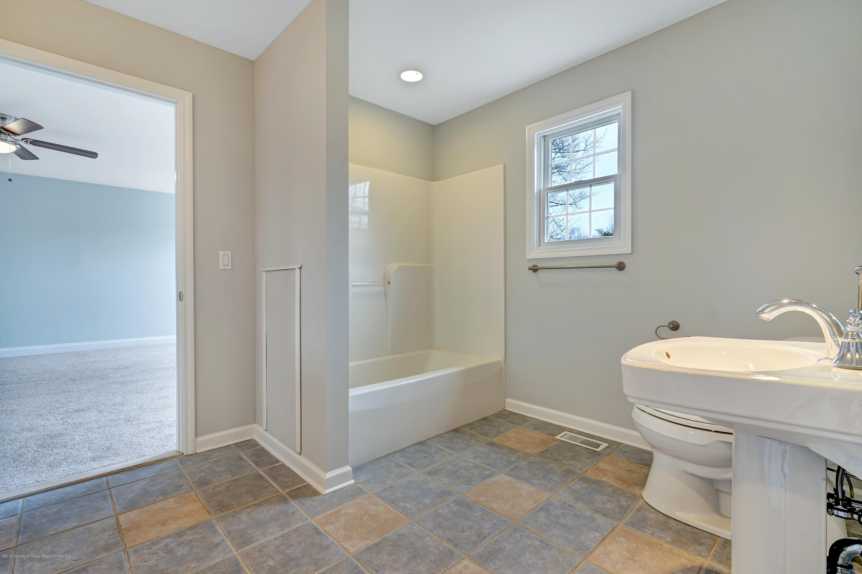 152 Bowline Road Manahawkin, NJ 08050 - Photo 24 of 29 a bathroom with a sink a toilet and shower