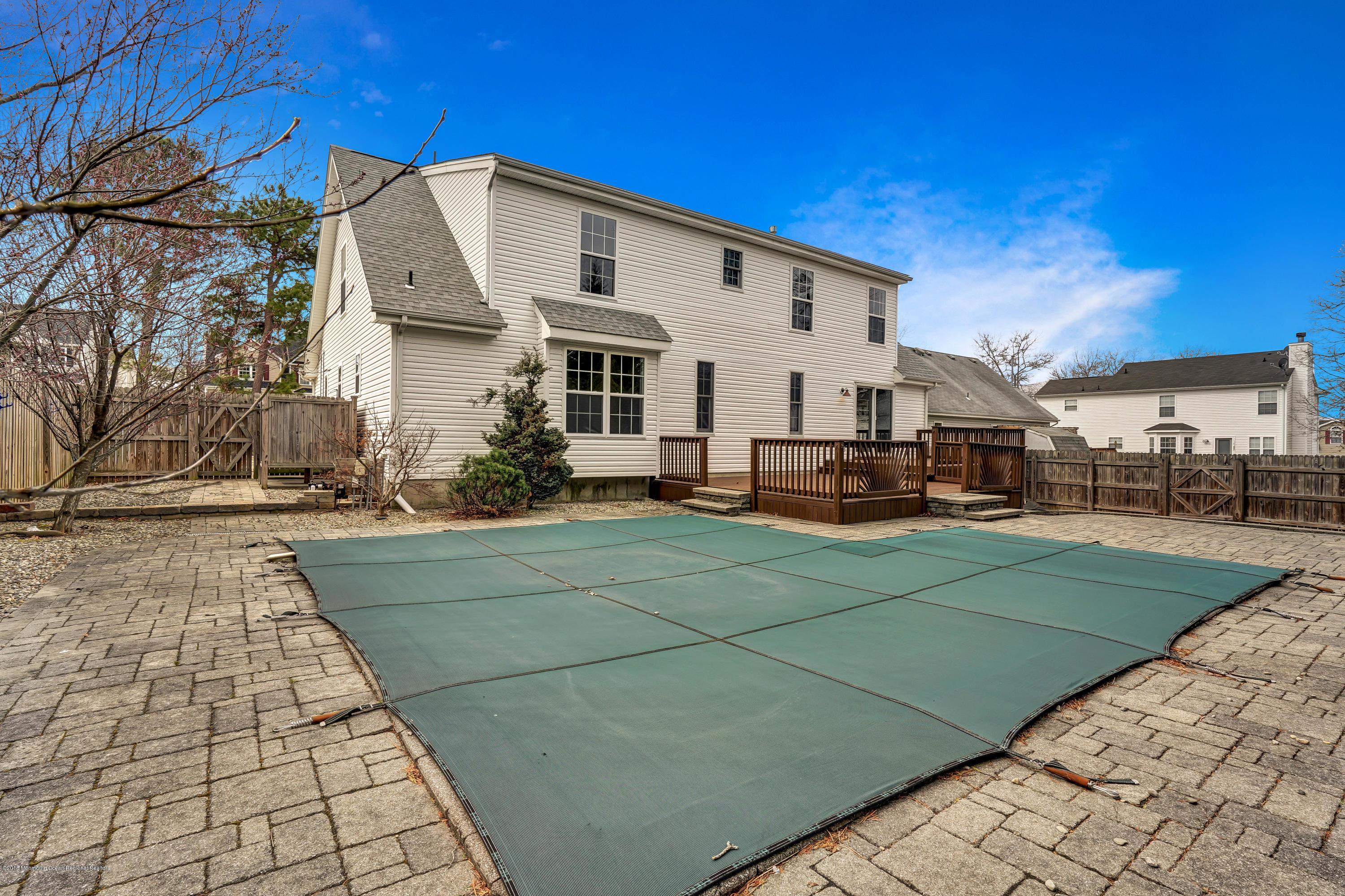 152 Bowline Road Manahawkin, NJ 08050 - Photo 28 of 29 a front view of a house with a yard