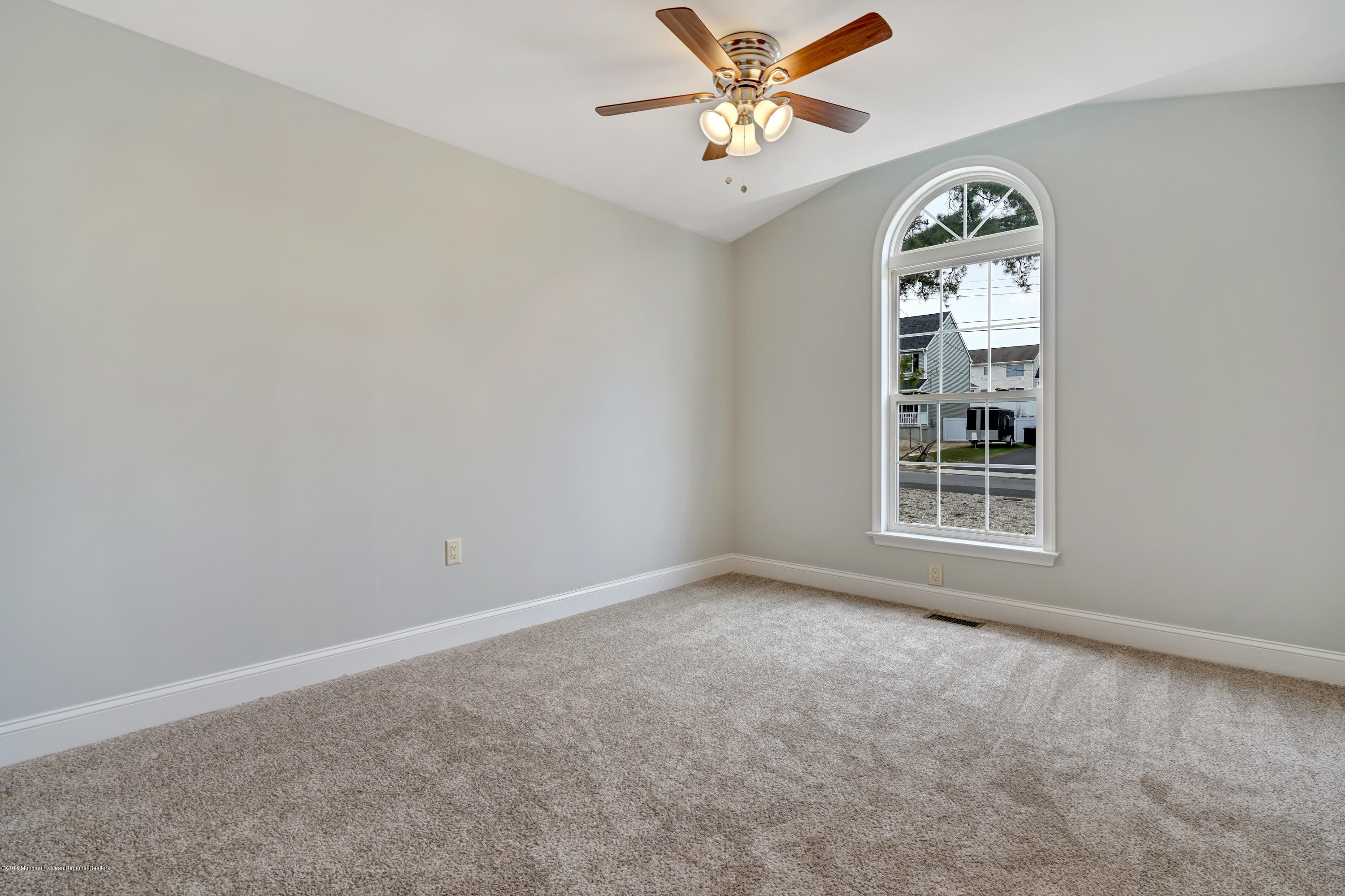 152 Bowline Road Manahawkin, NJ 08050 - Photo 5 of 29 an empty room with windows and fan