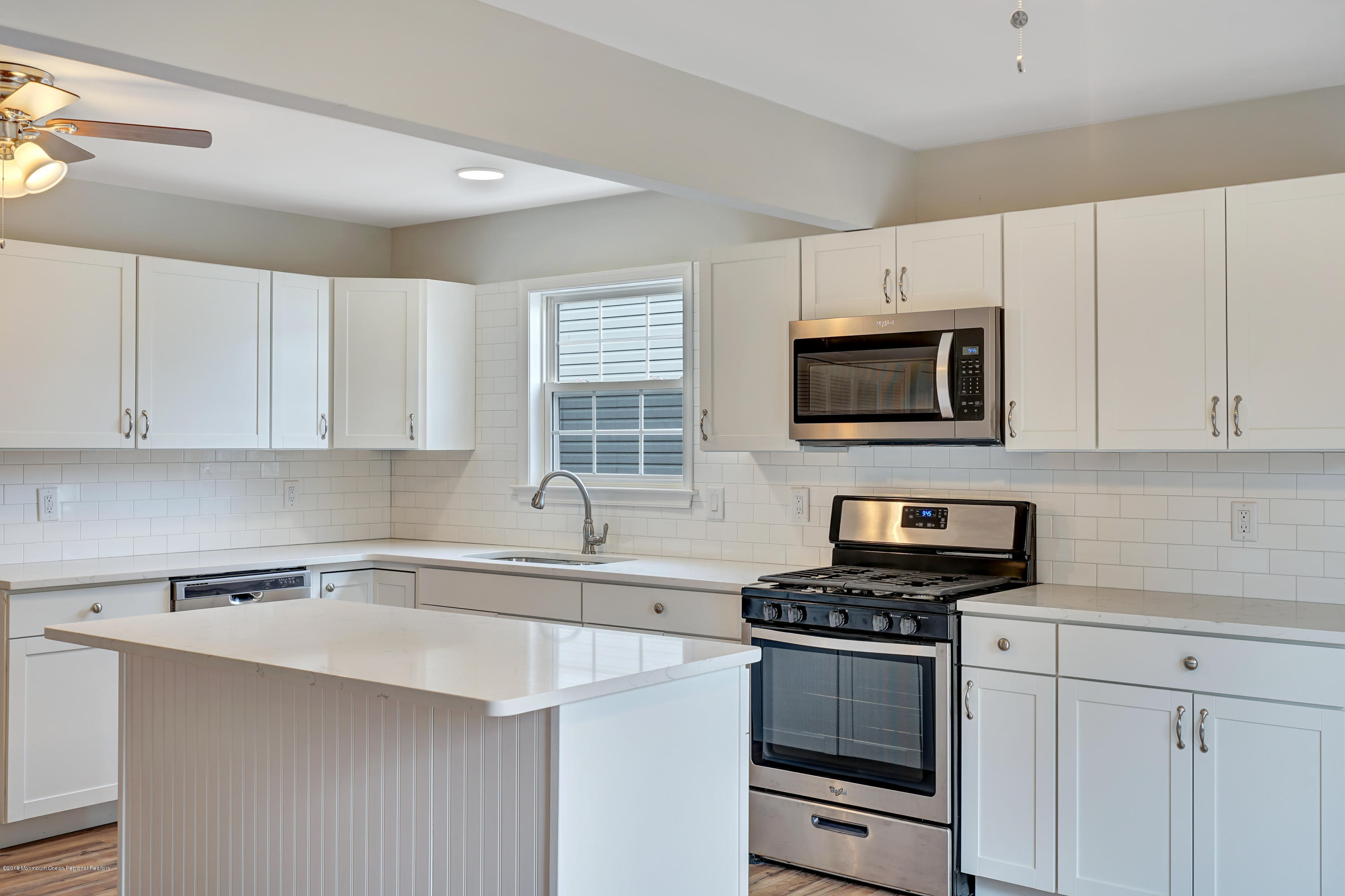 152 Bowline Road Manahawkin, NJ 08050 - Photo 9 of 29 a kitchen with cabinets stainless steel appliances a sink and a counter space