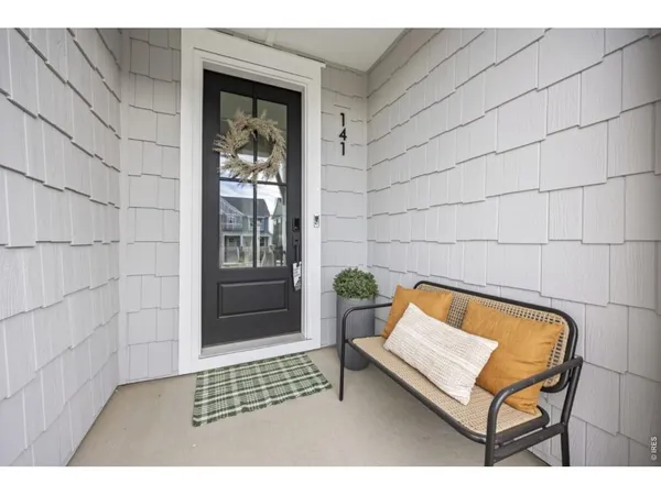 a bench sitting in front of a door