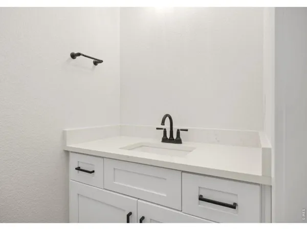 a bathroom with a sink and vanity