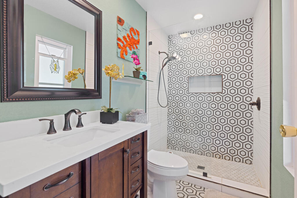 68110 Risueno Road Cathedral City, CA 92234 - Photo 11 of 33 a bathroom with a sink a toilet and a mirror