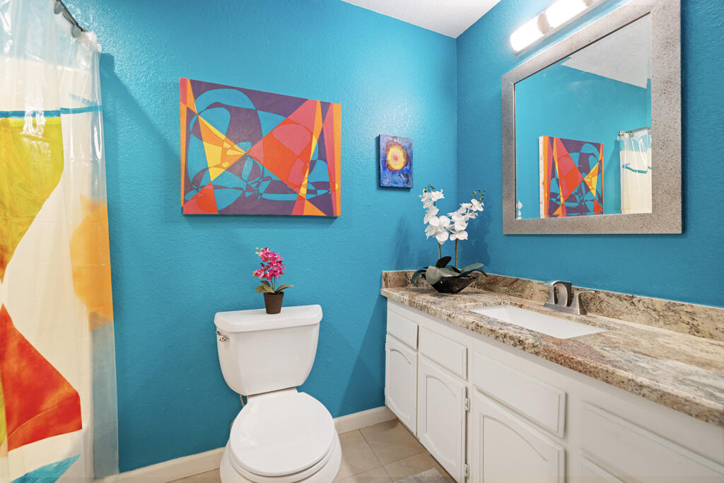 68110 Risueno Road Cathedral City, CA 92234 - Photo 14 of 33 a bathroom with a toilet sink and mirror