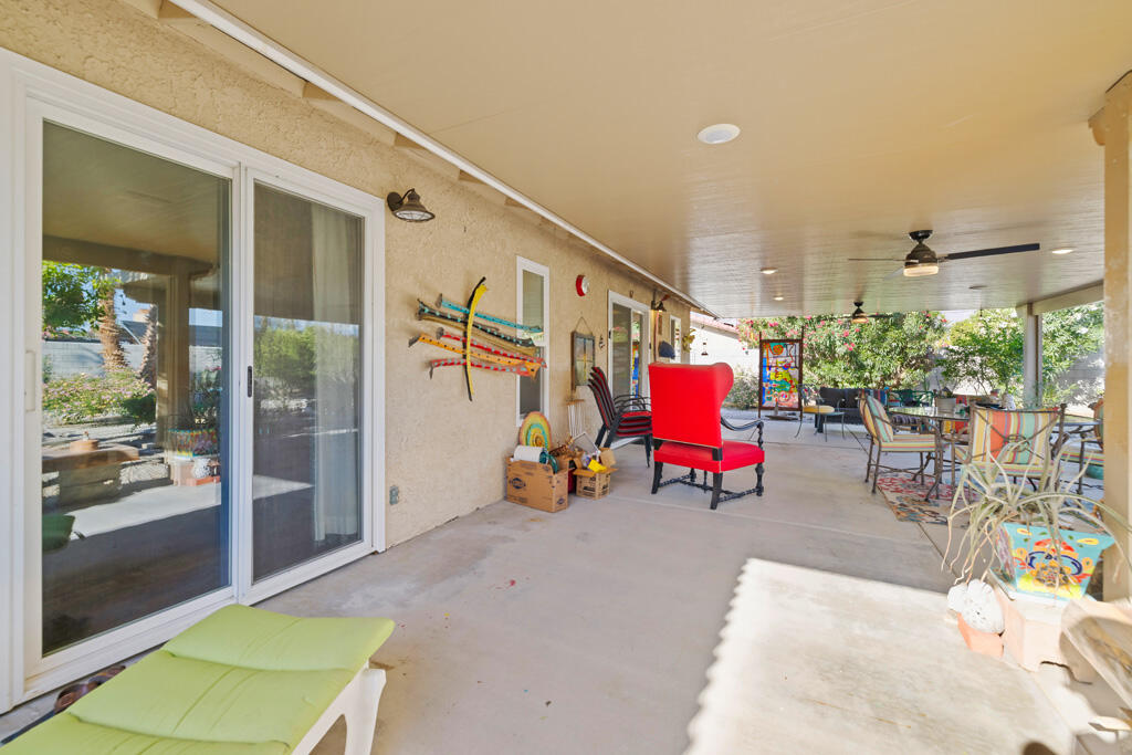 68110 Risueno Road Cathedral City, CA 92234 - Photo 15 of 33 a living room with lots of furniture and a rug