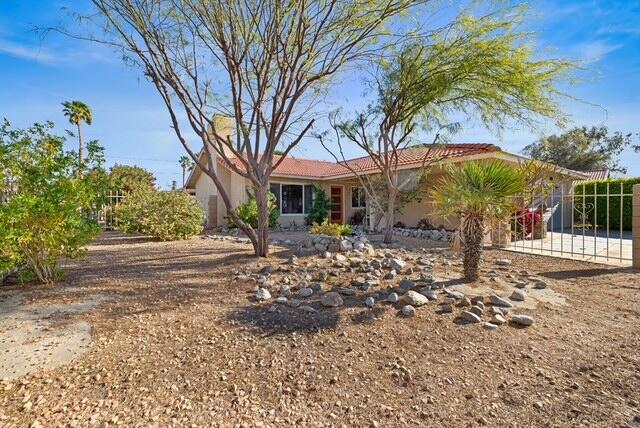 68110 Risueno Road Cathedral City, CA 92234 - Photo 24 of 33 a front view of a house with garden