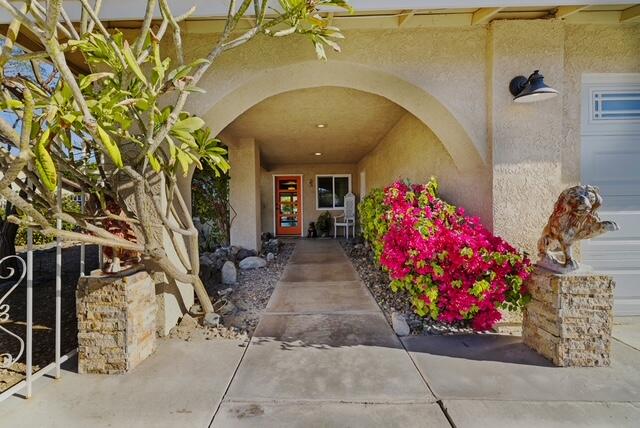 68110 Risueno Road Cathedral City, CA 92234 - Photo 28 of 33 a view of entryway with flower pots