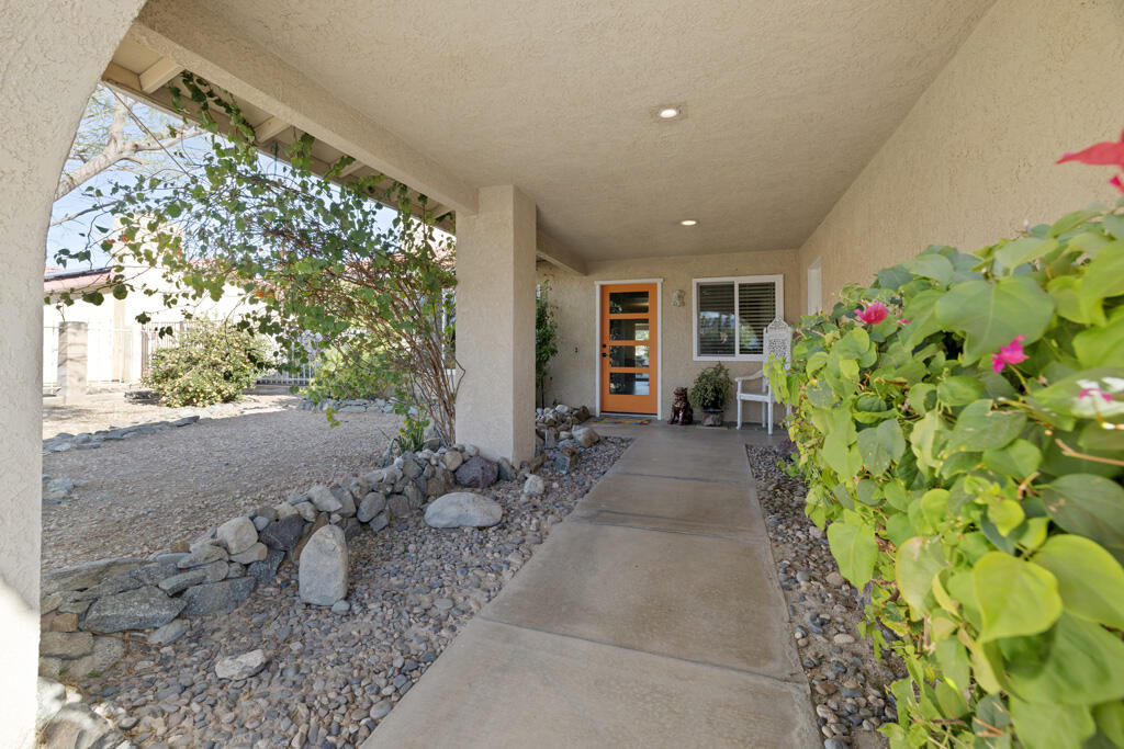68110 Risueno Road Cathedral City, CA 92234 - Photo 29 of 33 a view of a porch with chairs potted plants