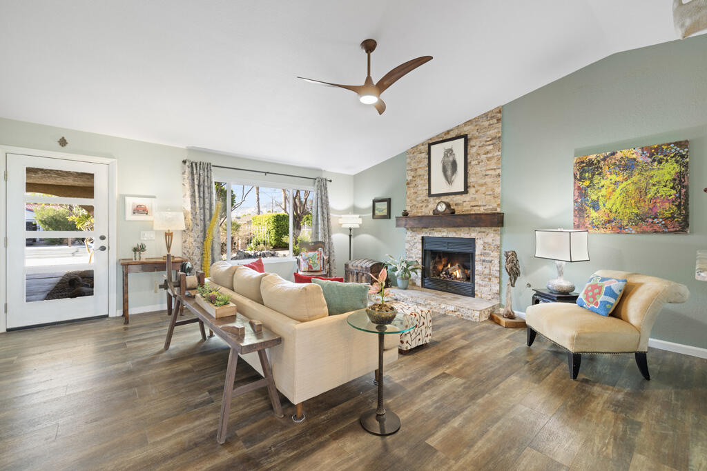 68110 Risueno Road Cathedral City, CA 92234 - Photo 3 of 33 a living room with furniture a window and a fireplace