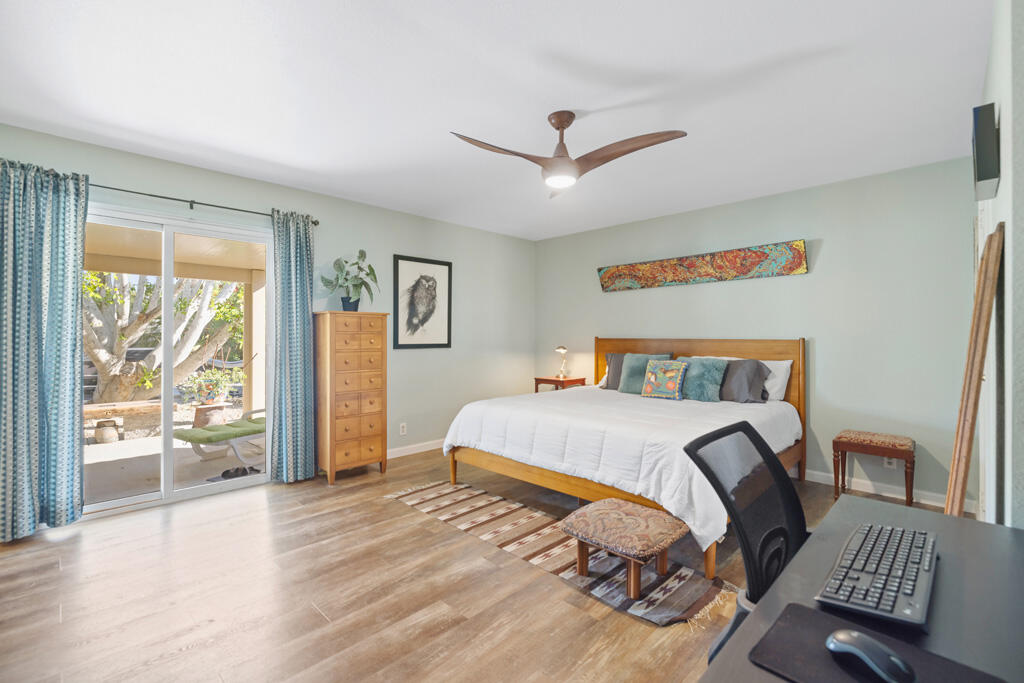 68110 Risueno Road Cathedral City, CA 92234 - Photo 9 of 33 a bedroom with a large bed and a window