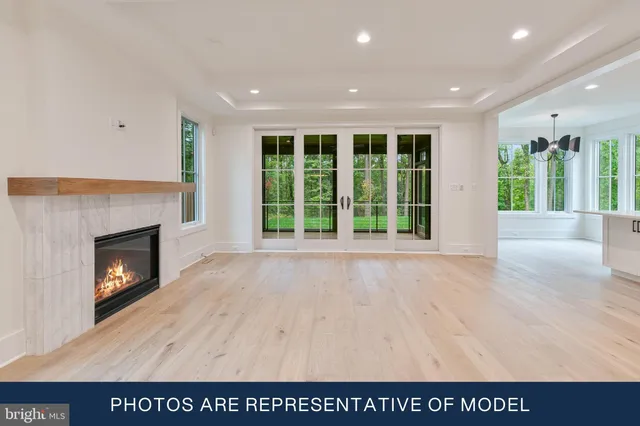 a view interior of a house with wooden floor windows and a chandelier