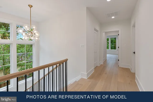 a view of entryway with stairs and wooden floor
