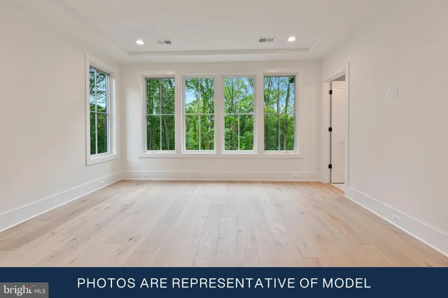 a white bath tub sitting next to a window