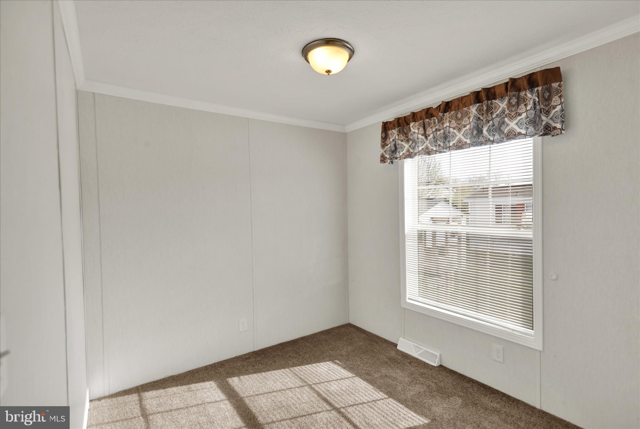 3450 Mountain Road, Unit M59 Hamburg, PA 19526 - Photo 17 of 35 a view of an empty room with a window