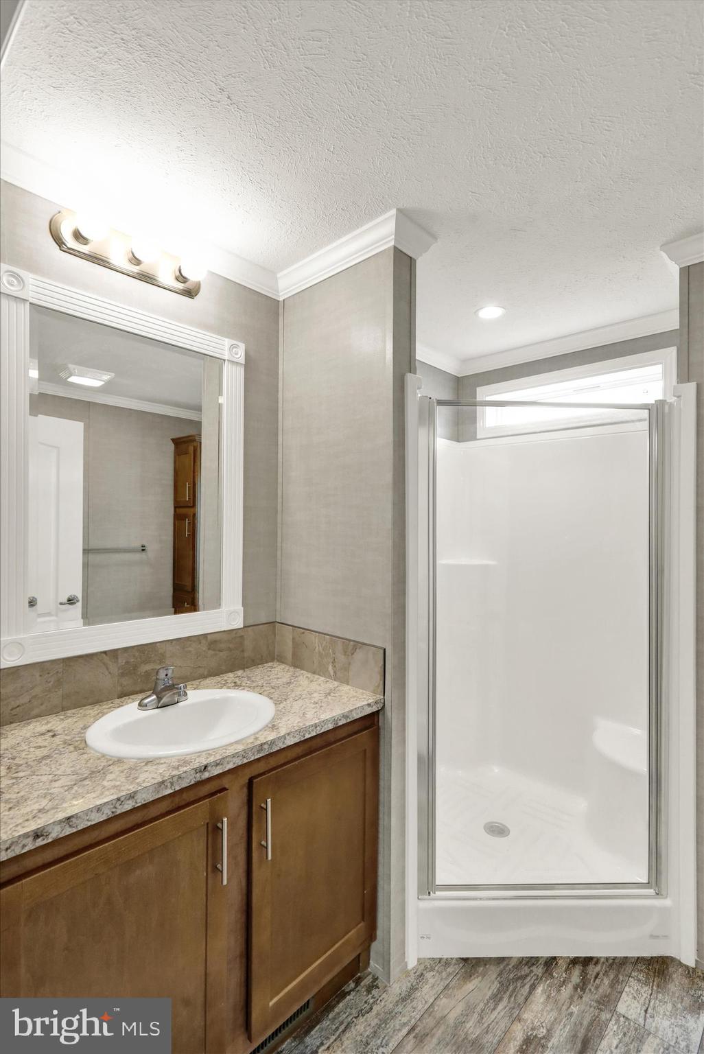 3450 Mountain Road, Unit M59 Hamburg, PA 19526 - Photo 27 of 35 a bathroom with a granite countertop sink mirror and