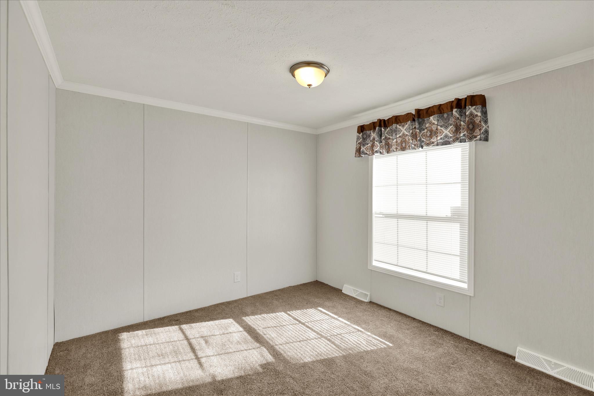3450 Mountain Road, Unit M59 Hamburg, PA 19526 - Photo 29 of 35 an empty room with windows