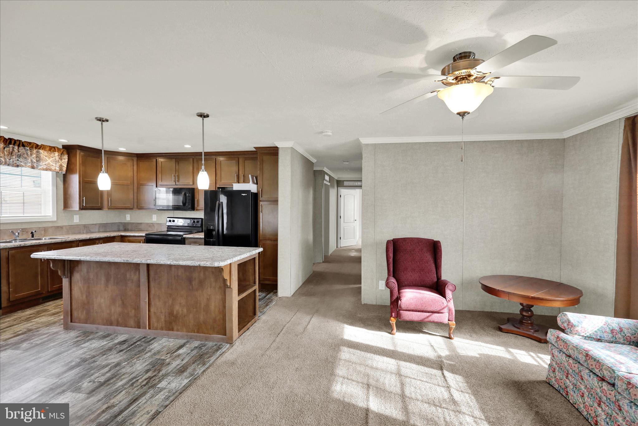 3450 Mountain Road, Unit M59 Hamburg, PA 19526 - Photo 8 of 35 a large kitchen with a table and chairs