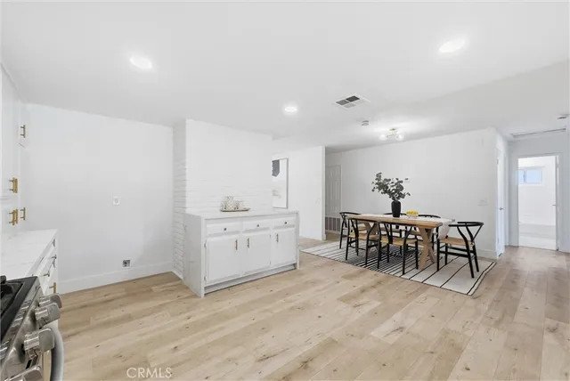 a view of dining room and wooden floor