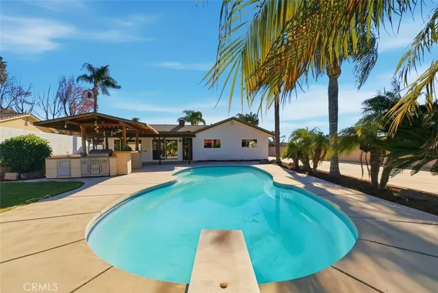 a view of a house with a swimming pool