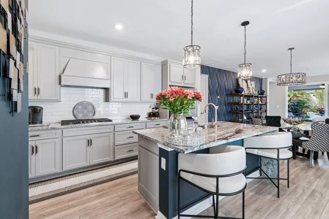 a view of a hallway view with wooden floor and living room