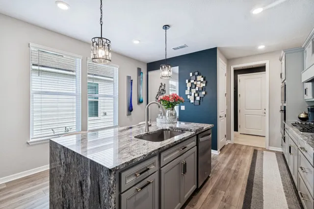 a bathroom with a sink a vanity and a mirror