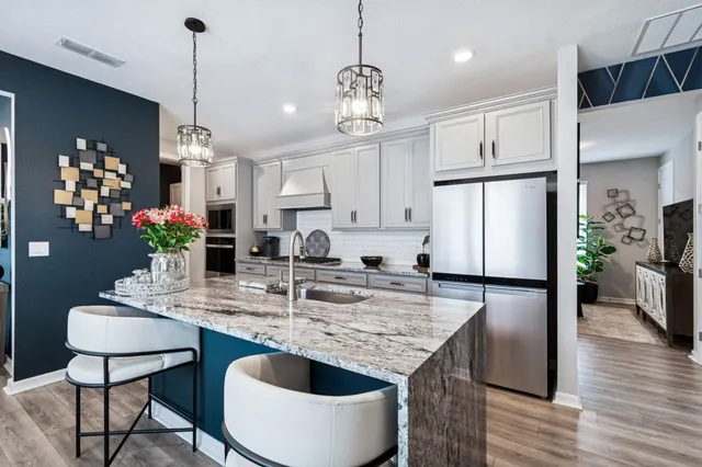 a bathroom with a sink a mirror a toilet and a shower