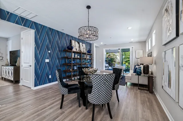 a view of a house with a yard and sitting area