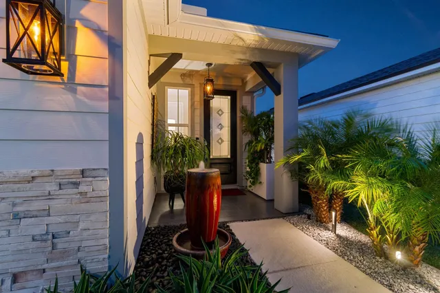 a kitchen with stainless steel appliances kitchen island granite countertop a sink and cabinets