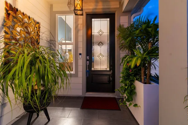 a kitchen with stainless steel appliances granite countertop a sink a stove and a wooden floors