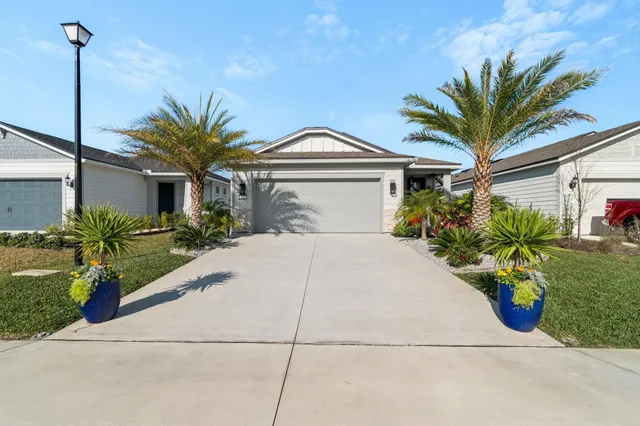 a kitchen with stainless steel appliances kitchen island granite countertop a stove a sink and a microwave