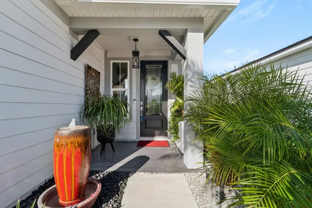a living room with furniture and a book shelf