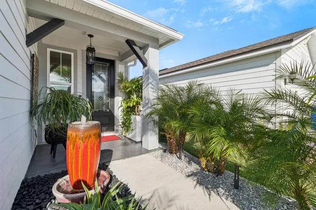a living room with furniture and a book shelf