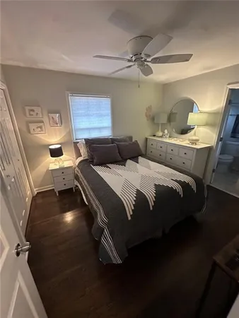 a bedroom with two beds and painted walls