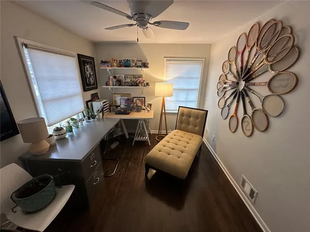 a workspace with furniture and window