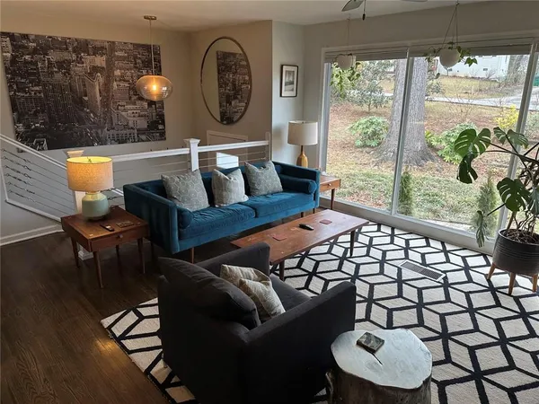 a living room with furniture and a large window