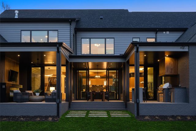 a view of living room with a flat screen tv and a fireplace