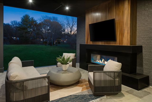 a kitchen with a sink dishwasher and a dining table with wooden floor