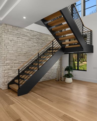 a kitchen with granite countertop a dining table and chairs