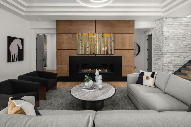 a outdoor living space with furniture and a flat screen tv