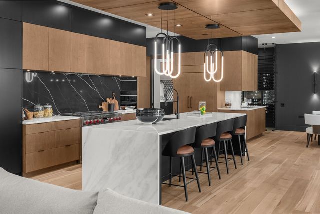 a bathroom with a tub a sink and mirrors