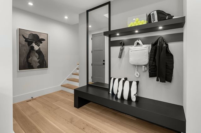 a living room with furniture and a large window with outer view