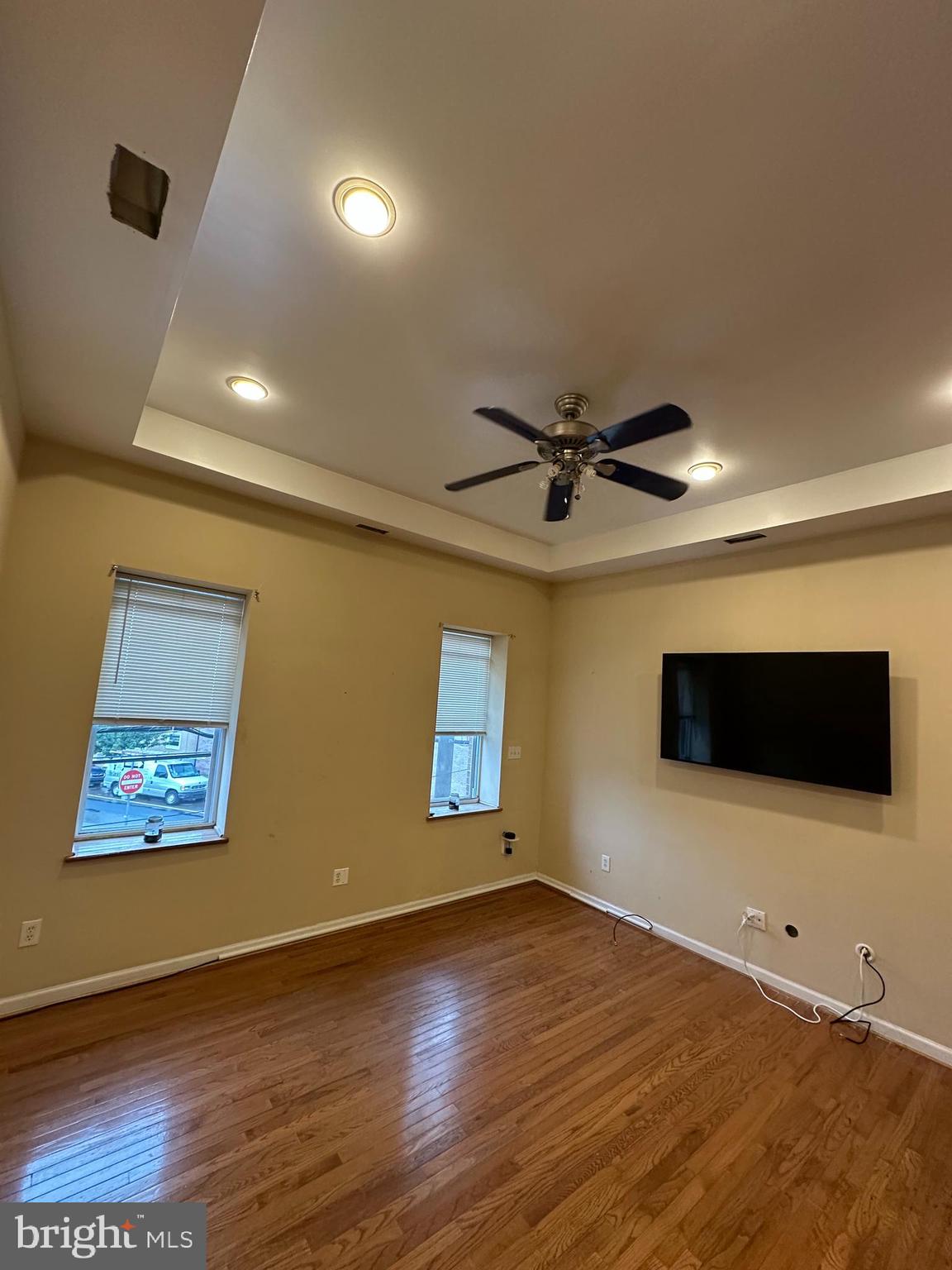 2528 South 13th Street, Unit 2 Philadelphia, PA 19148 - Photo 2 of 7 a view of an empty room with wooden floor and a ceiling fan