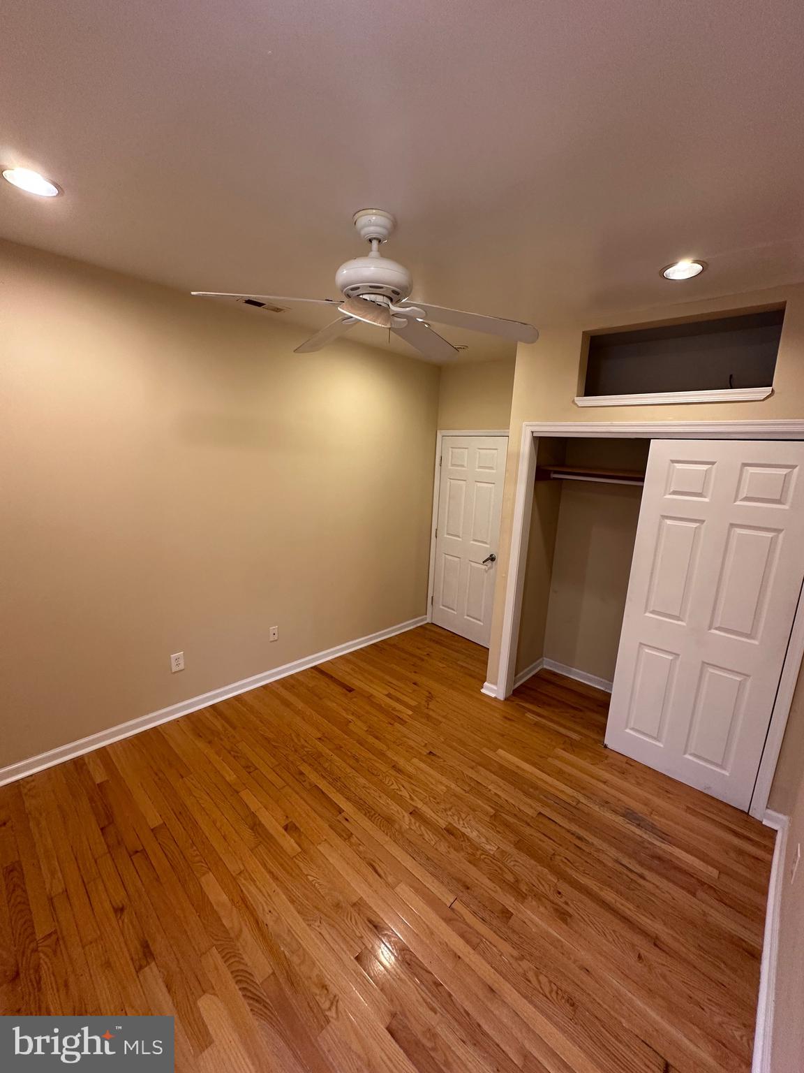 2528 South 13th Street, Unit 2 Philadelphia, PA 19148 - Photo 3 of 7 wooden floor in an empty room with a window