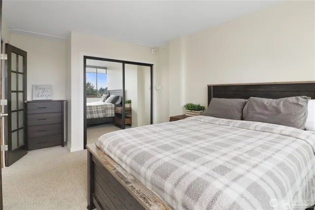 a bedroom with a bed and walk in closet