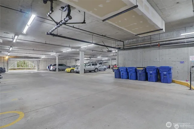 a view of parking garage with cars