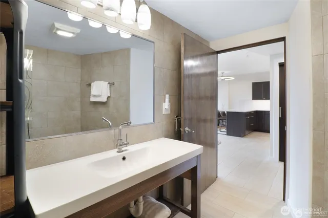 a bathroom with a sink and a mirror